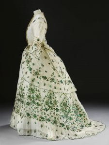 Victorian white cotton dress with stitched green iridescent beetle wings into patterns