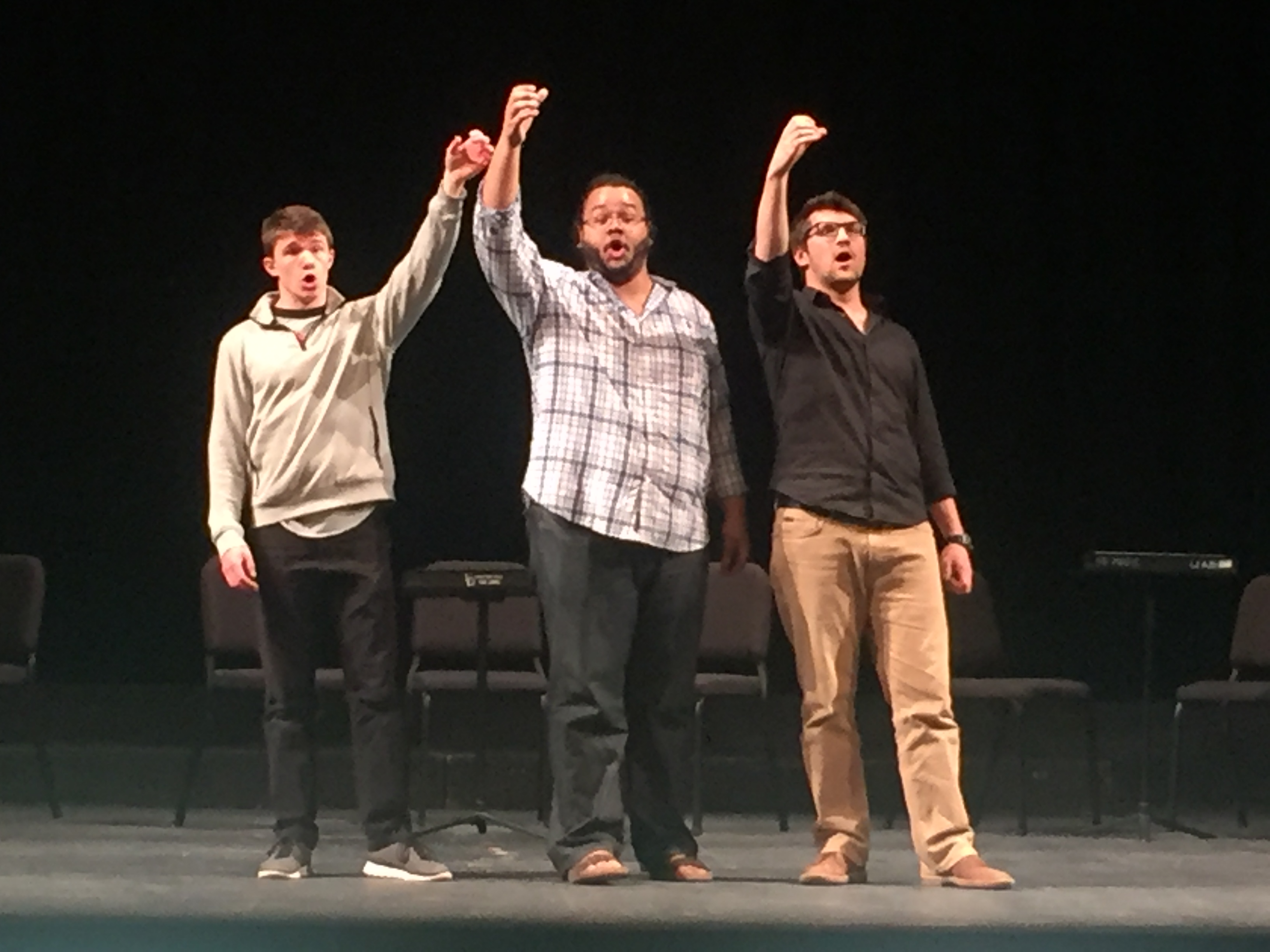 Cast members Benjamin Dutton, Travis Lucas, and Ethan Udovich (l. to r.) rehearsing a scene from Act I of Mozart's Cosi fan tutte