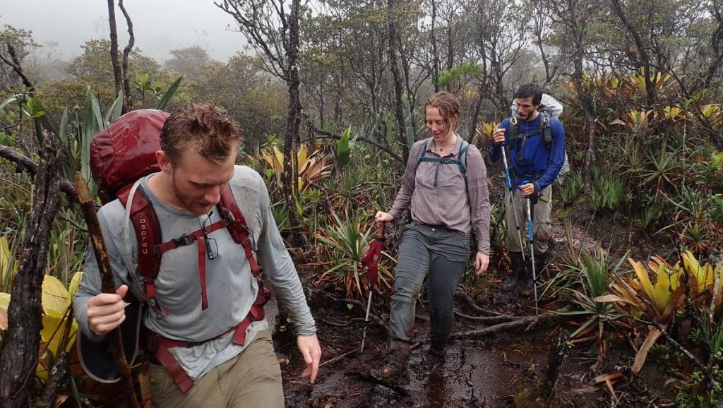 Klinger with student research assistant and Brazilian geographer hiking in Amazon