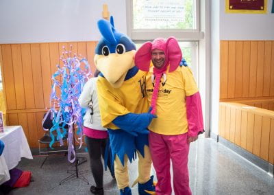 YouDee, the University's mascot along with a person representing the elephant in the room, challenging the stigma associated with mental health struggles