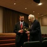 Giving Russell plaque