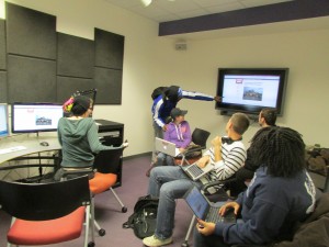 Students using the multimedia design center to work on a group project for SOCI 471 Disaster, Vulnerability, and Development in Fall semester, 2013
