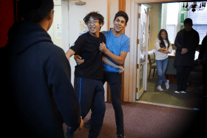 Two students act out a fight scene from The Man Who Moved a Mountain, which was another fable portrayed in Wednesday's Five Minute Fairy Tales.