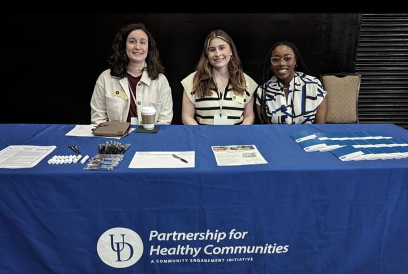 The Partnership for Healthy Communities team at their community partner table