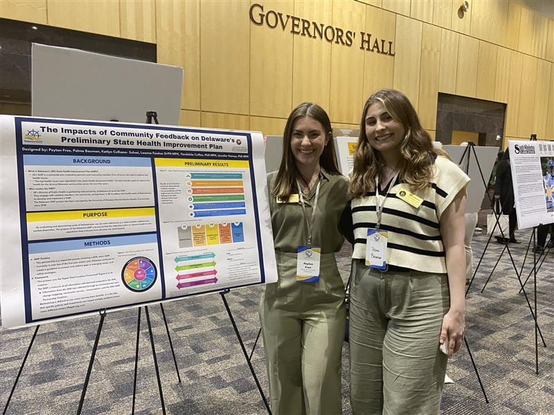 The State Health Improvement Plan team with their poster during the community gallery walk