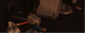 The contents of a victim’s purse dumped on the ground during a random mugging, from the beginning of my favorite Pixar movie.
