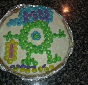 Time to focus on that cream cheese pie from the above photo, decorated by all the cousins. In my opinion, we created a beautiful rendition of Mike Wazowski, with a scream canister in his left hand.