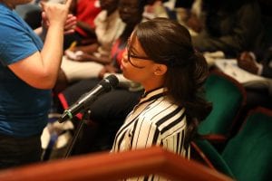 Ayanda Paine, a UD Mandela Fellow, asks U.S. Senator Chris Coons a question