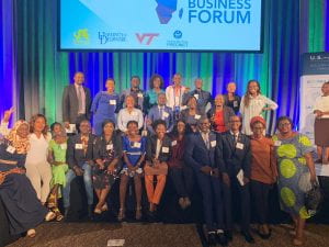Fellows stand and sit for a group photo at the African Business Forum