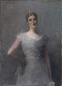 A torso-length portrait of a young white woman wearing a sleeveless ball gown with a low v-neckline. The woman poses with one gloved hand on her hip and the other limp by her side. She gazes off, unsmiling, to her upper right, as if meeting the eye of someone across the room.  The portrait is painted in a brushy, impressionistic style with a chalky grey background.