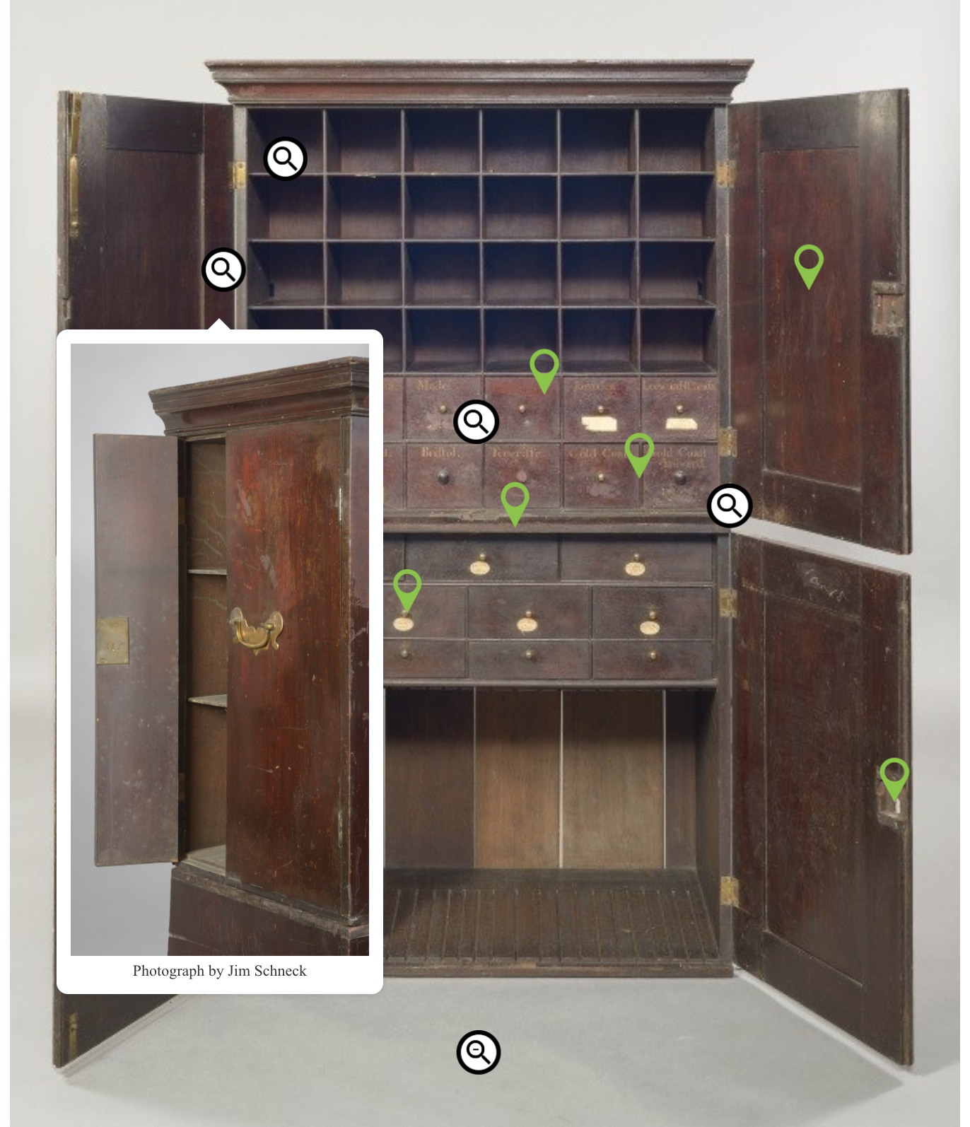 An example of the type of pop-up created by the touch screen interactive of a picture of a side compartment on the cabinet, obscured when the cabinet's doors are fully open.