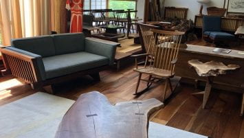 A wide angle shot of the Nakashima living room turned gallery.