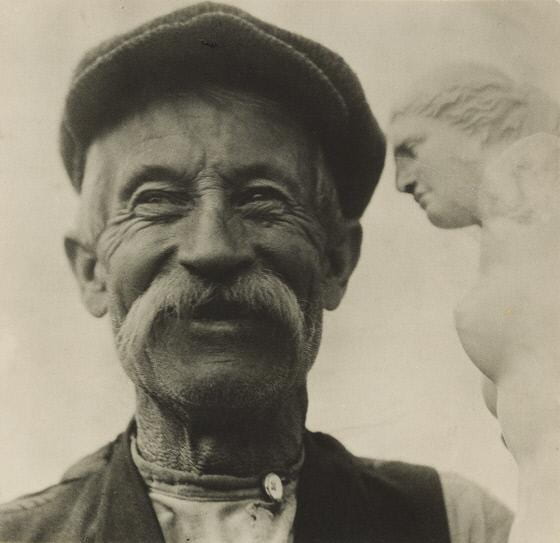 Fig. 6. Photograph of man with Venus de Milo sculpture preposterously positioned above his head. 