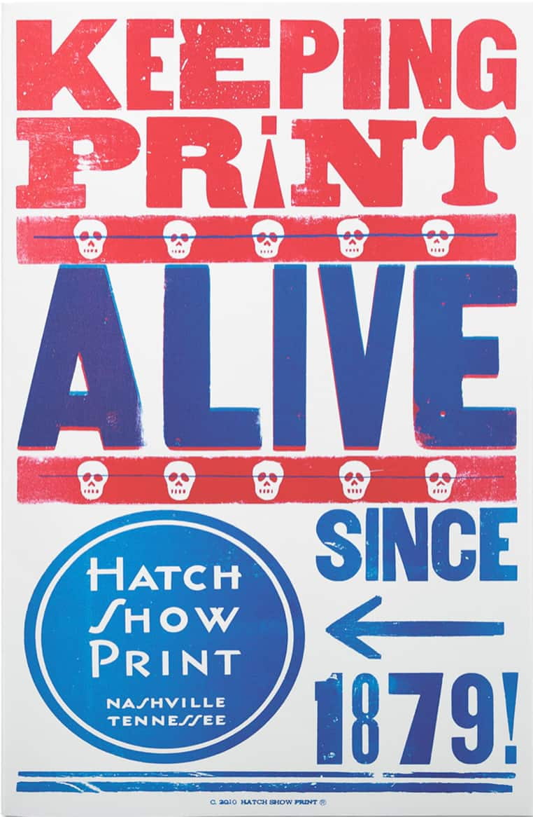 A poster with a white background reading, “KEEPING/ PRINT/ ALIVE.” The words “KEEPING” and “PRINT” are justified to the poster margins and are in printed in red ink. The “I” in “PRINT” is shown as an upside-down exclamation mark. Below the word “PRINT” is a red bar with five white stylized human skills. A thin blue line strikes through these skulls. Below this bar, the word “ALIVE,” also justified to the margins appears in blue letters with some red trim around it. Another red bar with 6 white skills and a thin blue line striking through it appears below “ALIVE.” Below this, in the lower left third of this poster is a blue circle with the words “HATCH/ SHOW/ PRINT/ NASHVILLE/ TENNESSEE” printed inside of it. A slightly larger blue circle frames this internal blue circle with the print. To the right of this circle are the words “SINCE/ 1879” with a left-pointing arrow separating the “SINCE” AND “1897.” (This arrow is pointing to the circle advertising Hatch Show Print to the left). Two parallel blue lines run across the bottom of the page forming a border of sorts, the upper of the two being thinner. Below these lines in tiny, tiny print is a line of copyright text.