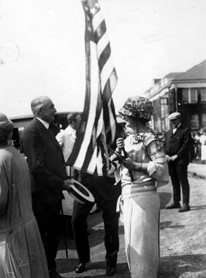 Elizabeth Jones, a student of the Women''s College of Delaware, speaks with Warren G. Harding, the President of the United States, during the 1923 commencement.
