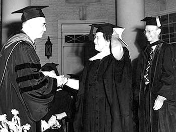 Mary Collison Fraim receives her honorary degree from John Alanson Perkins, the President of the University of Delaware, during the 1954 commencement. Behind her stands Allan Philip Colburn, Provost of the University.