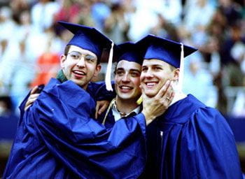 A few new graduates joke for the camera at the Spring 2000 commencement.