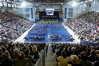 Family and friends gather in the Bob Carpenter Center to view the Winter 2002 commencement proceedings.