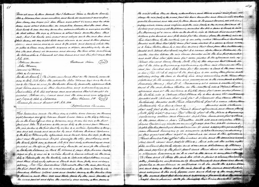 An open book with white pages containing black, handwritten text. Each page is lined with text and includes signatures of Rathmell Wilson