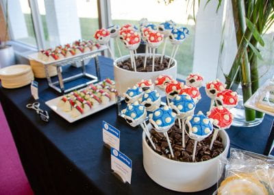 Cake pops decorated as blue and red Koopa shells
