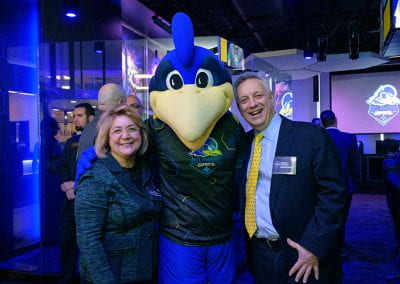President Assanis poses with First Lady Assanis and YoUDee