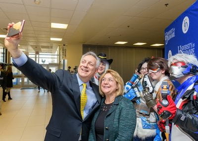 President and First Lady Assanis take a selfie with Overwatch cosplayers