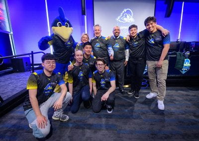 Esports players pose with President and First Lady Assanis, José-Luis Riera and YoUDee