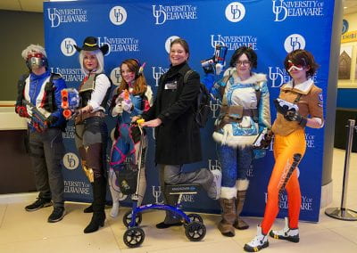 Sharon Pitt poses with Overwatch cosplayers