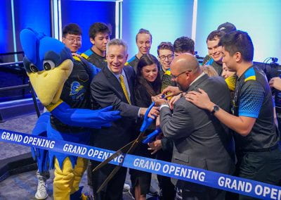 President Assanis, José-Luis Riera, YoUDee and Esports players cut the ribbon