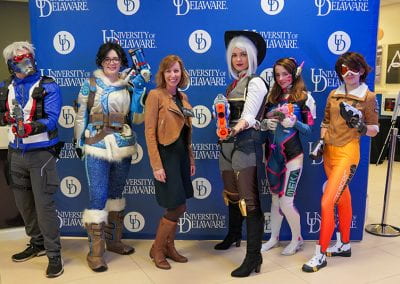 UD staff member poses with Overwatch cosplayers