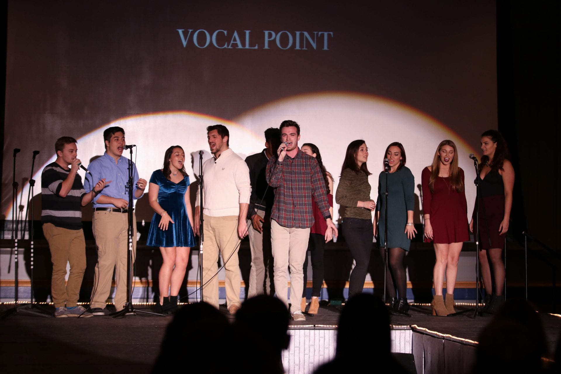Vocal Point student singing group perform at UDress fashion show. 
