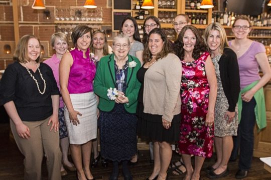 The 2014-2015 Women's Caucus Executive Board poses with Torch Award winner Barbara Settles.